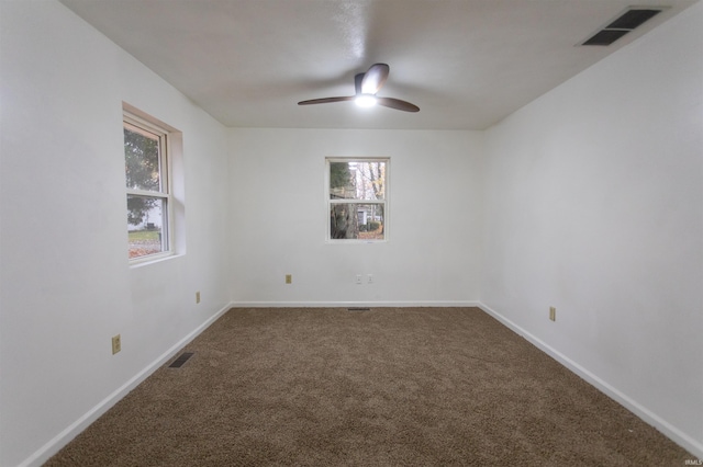 carpeted empty room with ceiling fan