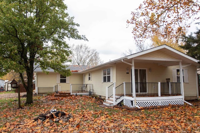 back of property with a wooden deck