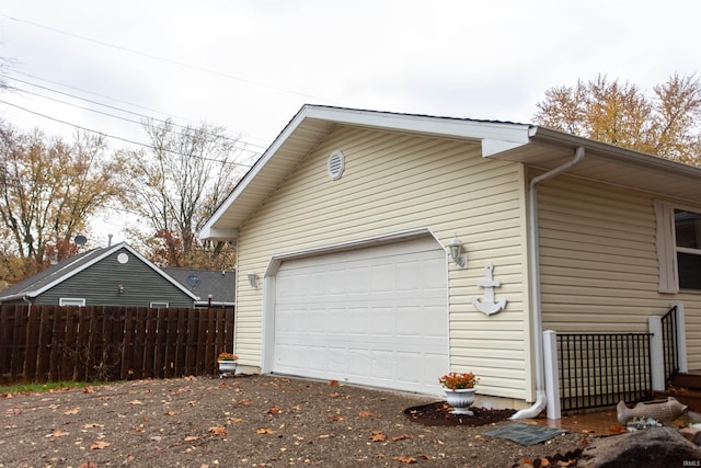 view of property exterior featuring a garage