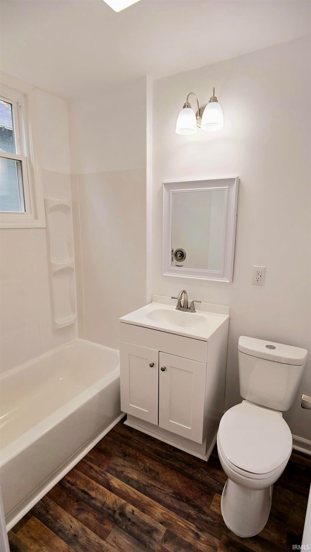 full bathroom with wood-type flooring, vanity, toilet, and shower / tub combination