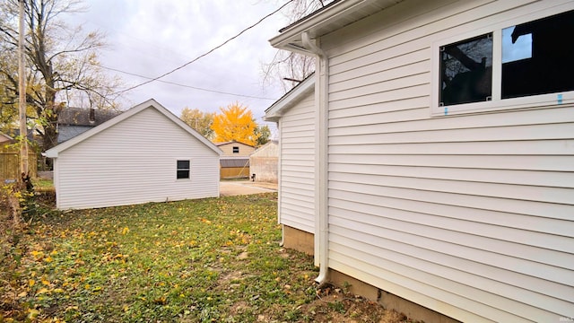 view of side of home featuring a lawn