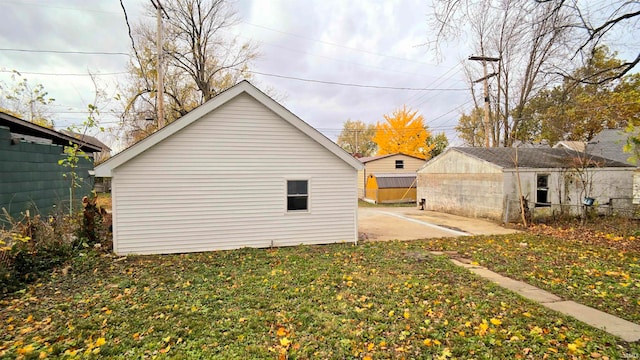 view of home's exterior featuring a patio and a yard