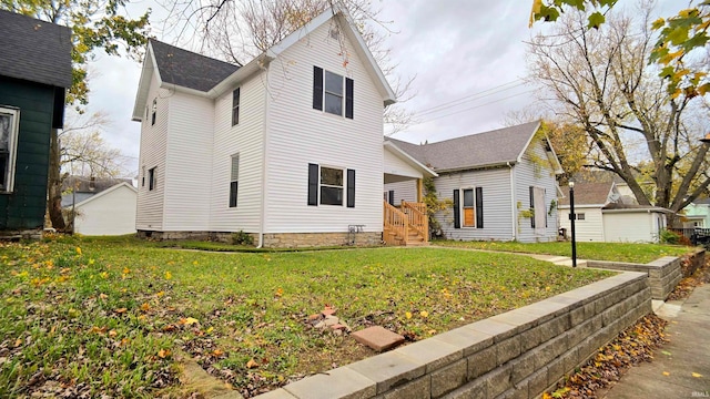 view of front of home with a front yard