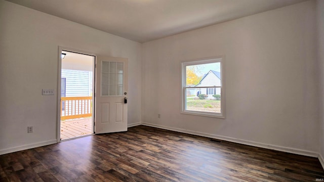 empty room featuring dark wood-type flooring