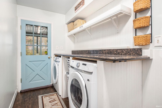 laundry area with dark hardwood / wood-style flooring and washer and clothes dryer