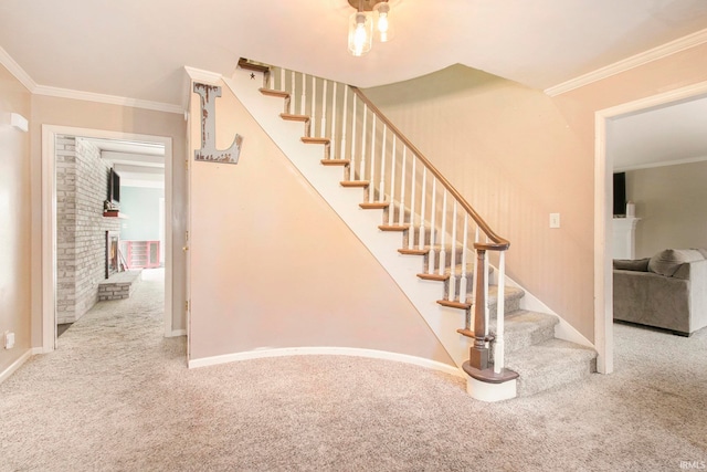 stairway with carpet flooring and ornamental molding