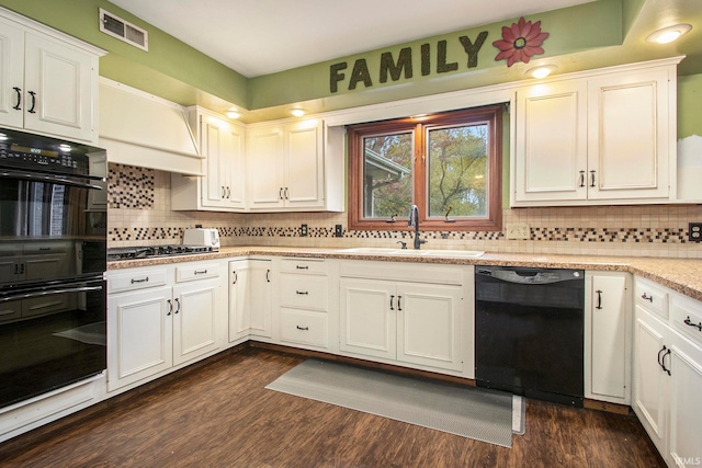 kitchen featuring black appliances, dark wood-type flooring, sink, and white cabinets