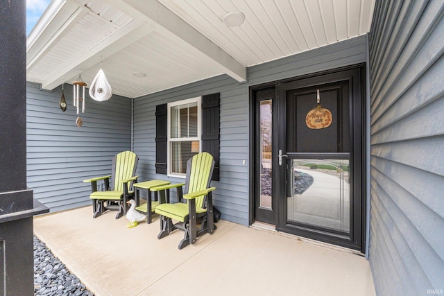 entrance to property featuring covered porch