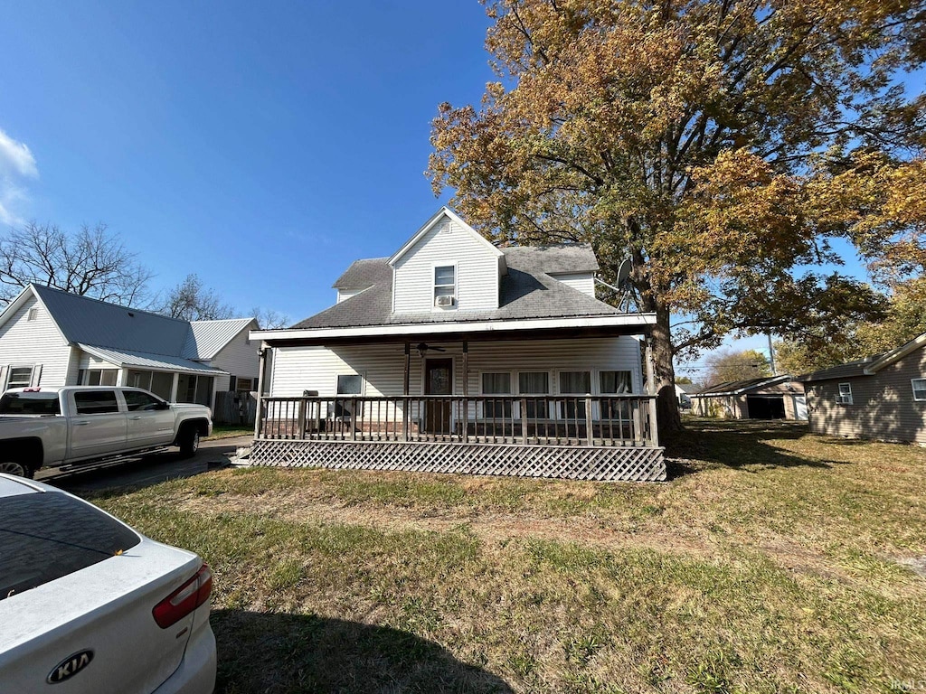 view of front of property with a front lawn and a deck