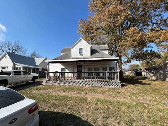 view of front of property with a front lawn and a deck