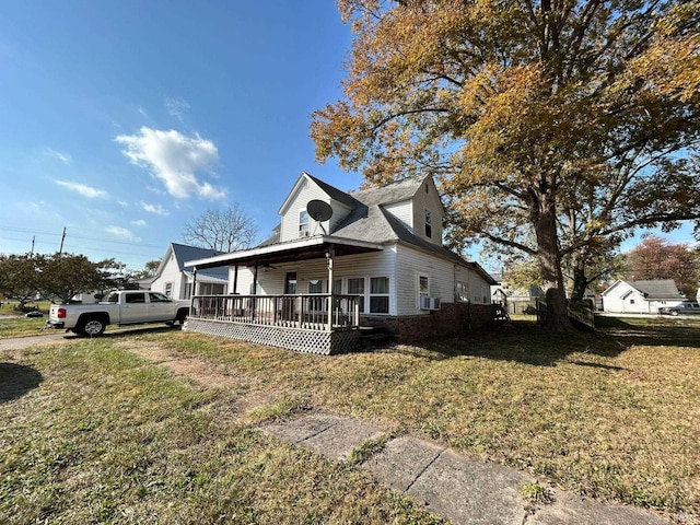 view of front of house featuring cooling unit, a front yard, and a deck