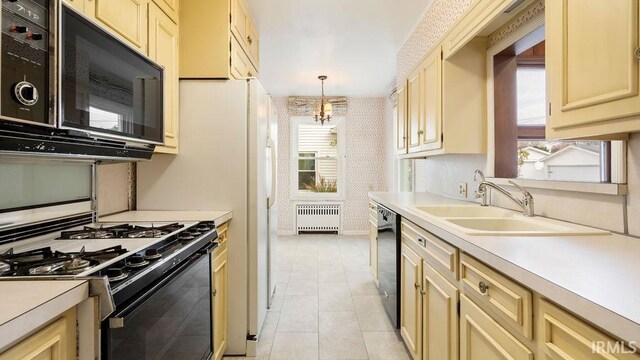 kitchen with radiator, a notable chandelier, sink, light tile patterned flooring, and pendant lighting