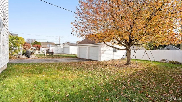 view of yard featuring a garage