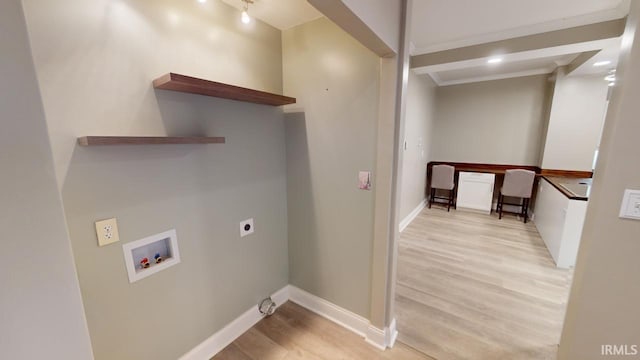 laundry room featuring light hardwood / wood-style floors, washer hookup, and electric dryer hookup