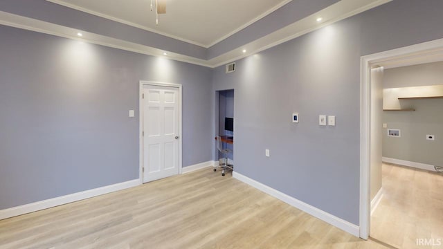 unfurnished room featuring ornamental molding, light hardwood / wood-style floors, and ceiling fan