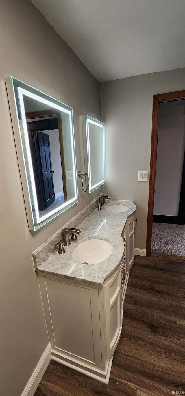 bathroom with vanity and hardwood / wood-style flooring