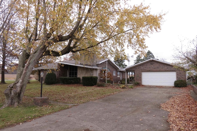 ranch-style home with a garage and a front yard