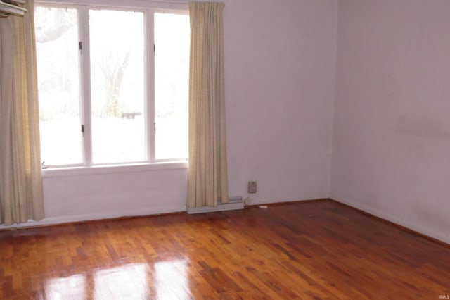 empty room featuring hardwood / wood-style flooring