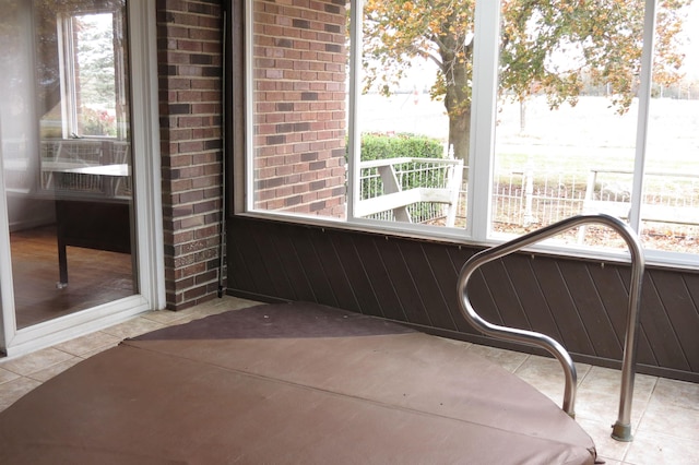 unfurnished sunroom featuring plenty of natural light