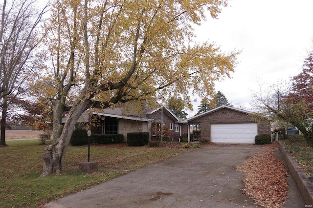 single story home with a garage and a front yard