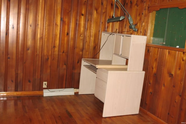 laundry room featuring wood walls and dark hardwood / wood-style floors