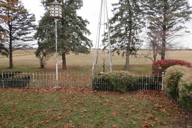 view of yard with a rural view