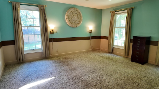 unfurnished room with carpet floors