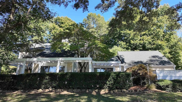 view of front of house with a pergola