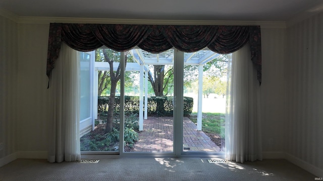 doorway to outside featuring ornamental molding