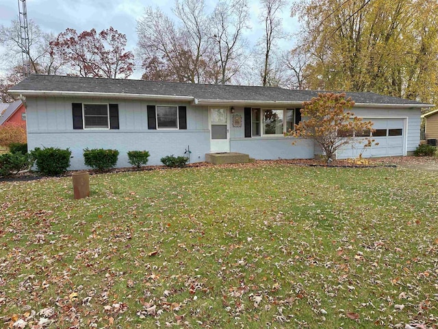 ranch-style house with a garage and a front yard