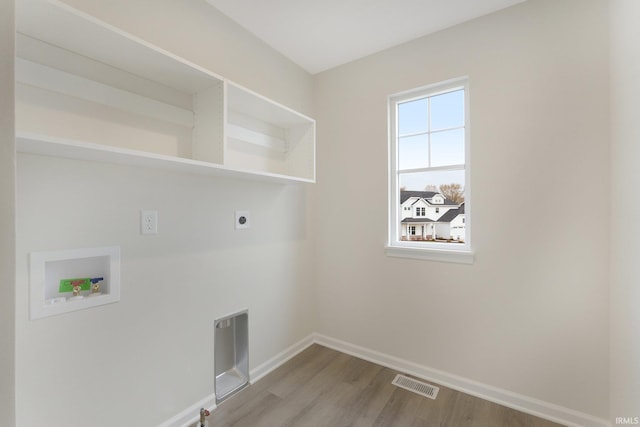 laundry area with washer hookup, hardwood / wood-style flooring, and hookup for an electric dryer