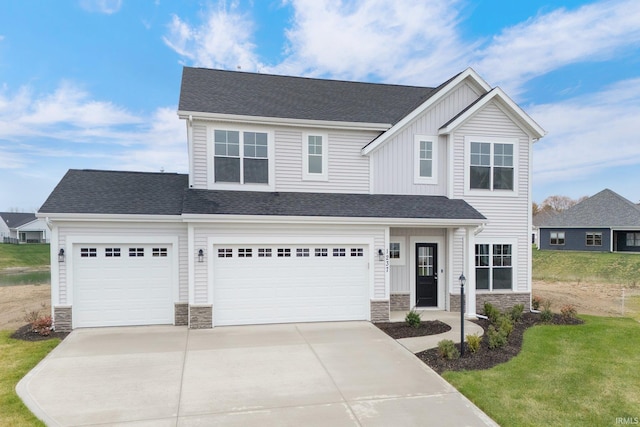 view of front facade with a front lawn and a garage