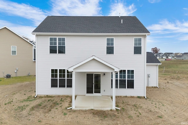 back of house with central AC unit and a patio area