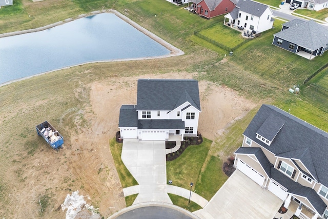 birds eye view of property with a water view