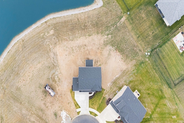 drone / aerial view with a water view and a view of the beach