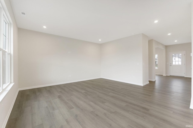 spare room with hardwood / wood-style flooring