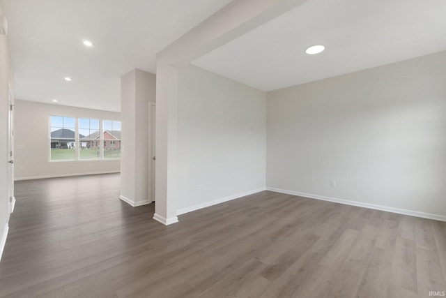 unfurnished room featuring hardwood / wood-style flooring