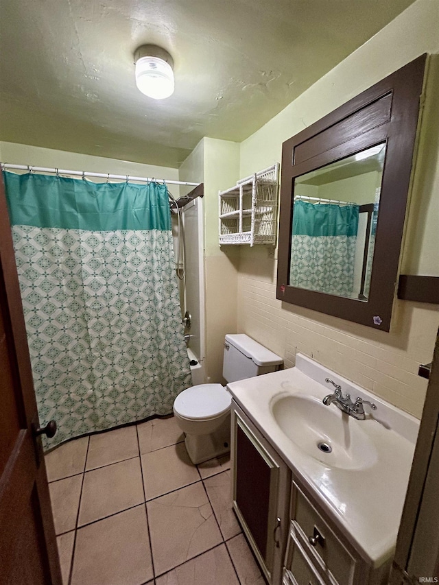 full bathroom with toilet, tile patterned flooring, and vanity