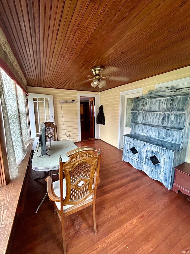 sunroom / solarium featuring wooden ceiling and ceiling fan