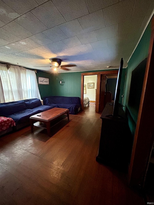 bedroom featuring wood finished floors and a ceiling fan