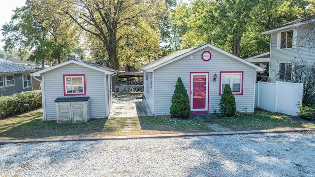 view of front facade featuring a storage shed