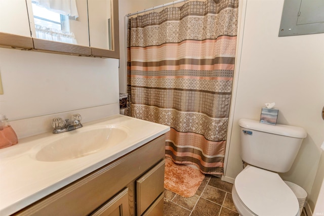 bathroom featuring tile patterned flooring, a shower with curtain, vanity, electric panel, and toilet