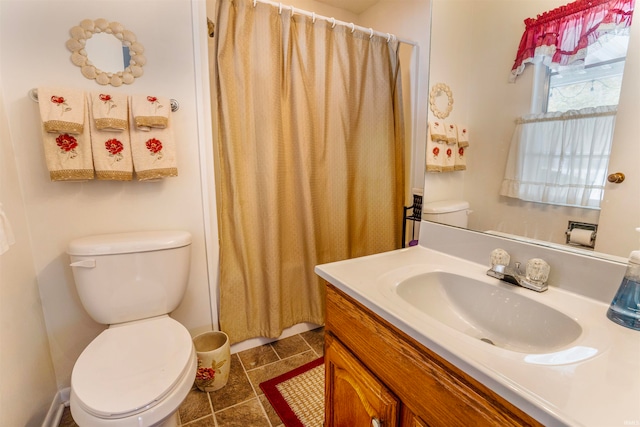 bathroom featuring a shower with shower curtain, tile patterned flooring, vanity, and toilet