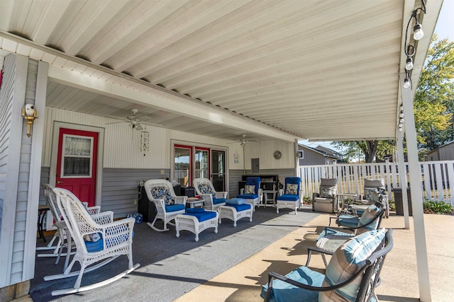 view of patio with ceiling fan and an outdoor living space