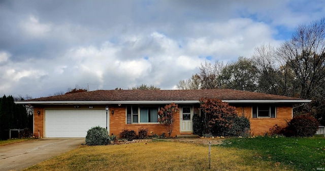 single story home featuring a garage and a front yard