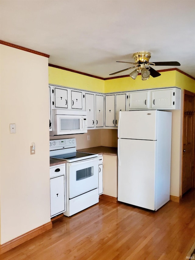 kitchen featuring light hardwood / wood-style floors, white cabinets, ornamental molding, ceiling fan, and white appliances