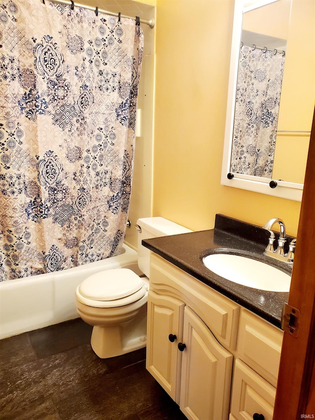 full bathroom with hardwood / wood-style flooring, vanity, toilet, and shower / bath combo with shower curtain