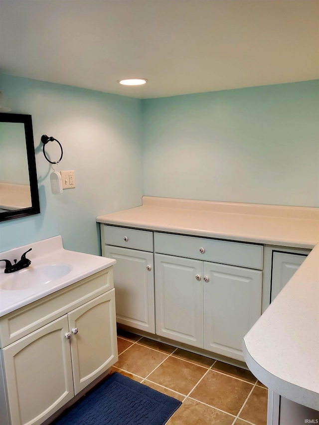 bathroom featuring tile patterned flooring and vanity