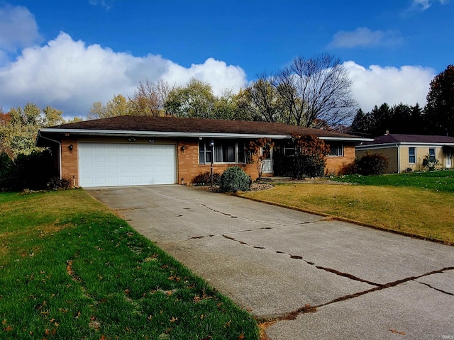 single story home featuring a front yard and a garage