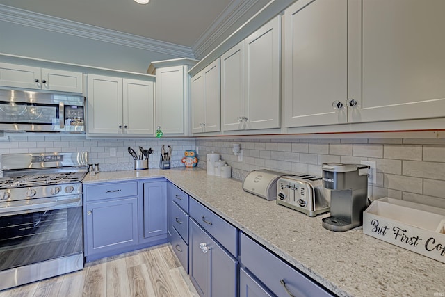 kitchen with stainless steel appliances, light stone counters, tasteful backsplash, crown molding, and light hardwood / wood-style flooring